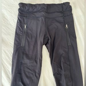 Lightly worn black Lululemon leggings with zippers, size 4!